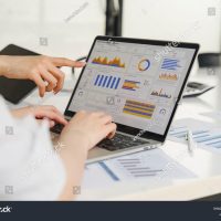 stock-photo-two-data-analysts-working-on-data-analysis-dashboard-for-business-strategy-2446370723